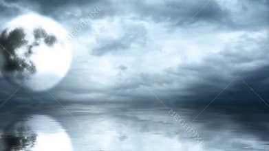 Full moon on cloudy sky with reflection in water