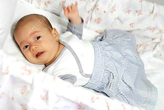 Crying baby girl in her crib