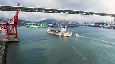 Large cargo sea ship transport shipment container from China, car traffic, drone hyperlapse aerial view