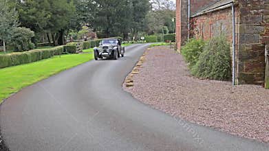 A 1933 Alvis Speed 20 SA Departs Rose Castle in Dalston, Cumbria, England
