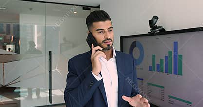 Financial analyst leads remote communication by business using smartphone