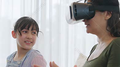 Granddaughter guide grandmother to dive in metaverse with VR. Divergence.