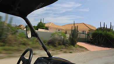 Off-road UTV tour through captivating rocky desert landscapes of Aruba, exploring rugged terrain and stunning vistas