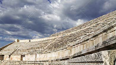 Roman Theatre in Amman, Jordan. Against the sky with clouds. 4K, time lapse