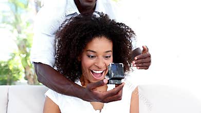 Man surprising his girlfriend with a proposal