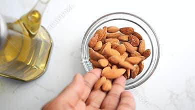 Making almond oil from almonds in the kitchen