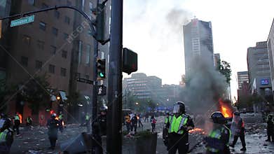 Tear gas exploding at chaotic downtown riot