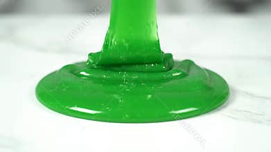 Green Gooey Slime Texture on Marble Surface Close Up at Daytime