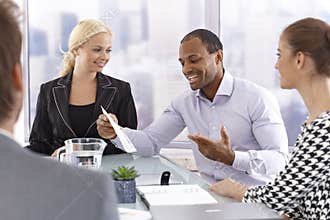 Confident businessman talking at meeting