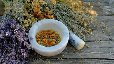 Woman with dried medicinal herbs. Selective focus.