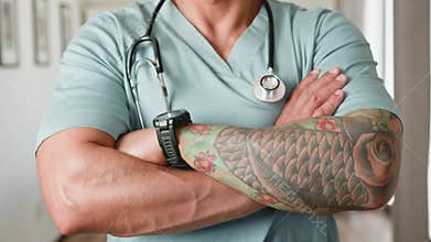 Confident Medical Professional with Tattooed Arm and Stethoscope Standing with Crossed Arms