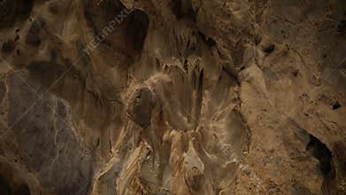 Meditation in a cave texture with stalactites and stalagmites in darkness.