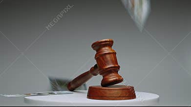 Gavel strikes in courtroom during important case in local justice system