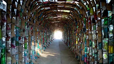 Arched channels made of colorful bottles, Generative AI