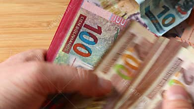 Bolivia money. Manually counting a large amount of cash. 200 boliviano banknotes. Financial business concept. Close up