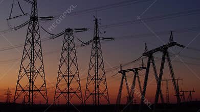 Electric substation on the background of sunset.
