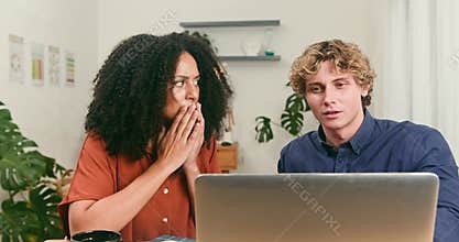 Diverse Tech Startup Colleagues React with Surprise and Concern to a Problem on Laptop Screen