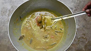 Small Snakehead or Channa orientalis fish curry.