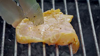 juicy marinated chicken is grilled with smoke and flames
