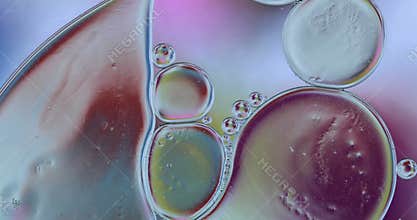 Movement oxygen bubbles in a liquid. Beautiful structure of water in macro a natural background.