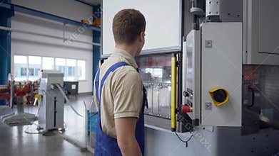 Industry scene with worker operating metal bending machines