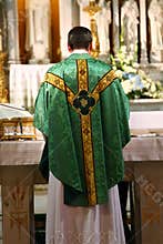 Catholic Priest facing altar