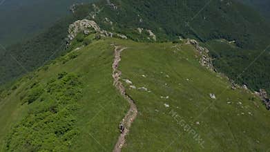 Aerial view of people walking down a mountain trail from Mount Beshtau in Pyatigorsk.