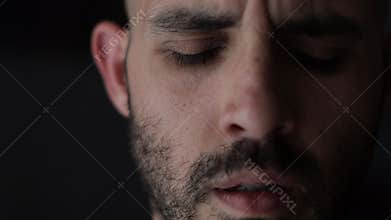 Worried, anxious and depressed man portrait. Close-up shot of bearded man