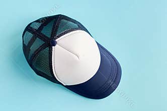 Baseball cap on blue background composition. Flat lay