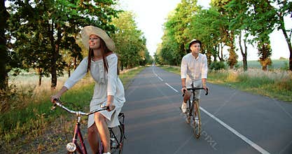 Couple Riding Bicycles on Countryside Road