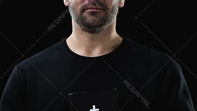 Poor crying man holding holy bible near heart, penance for sins, belief concept