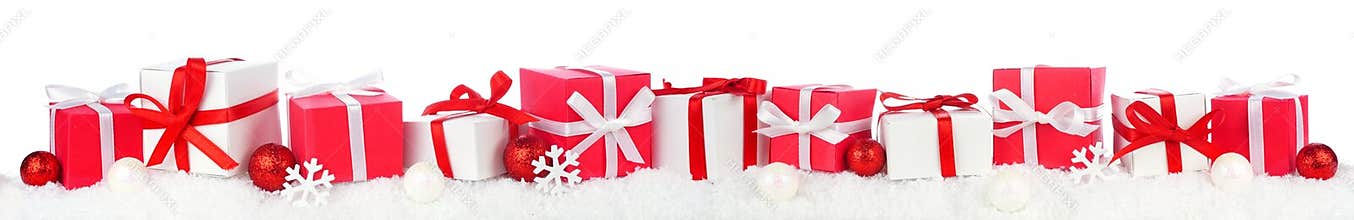 Christmas border of red and white gift boxes in snow isolated on white