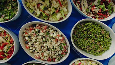 Different salads on table in restaurant view from above