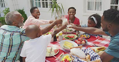 Happy family eating together at table