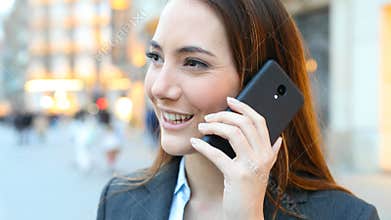 Executive calling on smart phone in the street