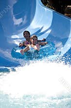 Girls having some water slide fun