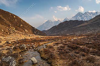 Himalaya mountains range and small stream water view from Tagnag village in Everest base camp trekking route, Nepal