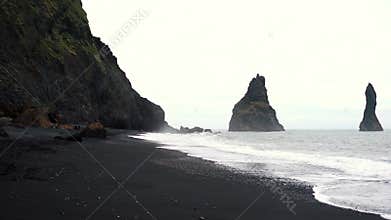Dramatic landscape of Black Sand Reynisfjara beach in Iceland
