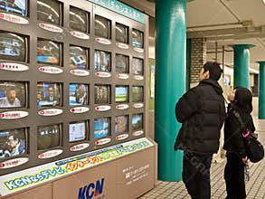 Watching TV in subway station
