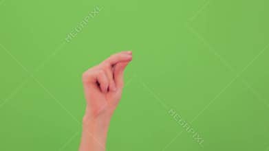 Man hand snap finger or clicks hand isolated on chroma key green screen.