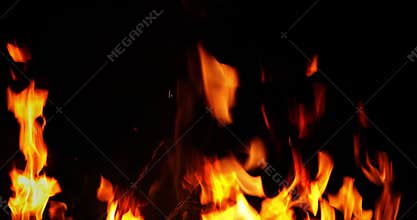 Flames from camp fire burning at night