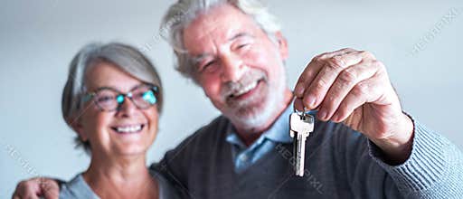Close up and portrait of two seniors or mature people buying a new house or car or some property - independent lifesyle and