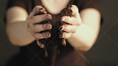 Organic fertilizer earth day caring hands soil