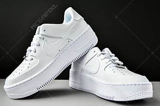 Zhytomyr, Ukraine - June 1, 2020: Nike Air Force 1 Sage white sneakers product shot on gray background. Illustrative editorial