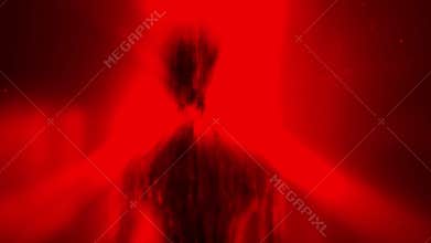 Alien monster silhouette in rays of light standing in doorway.
