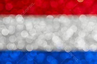 Abstract patriotic flag with bokeh lights, red white and blue glitter sparkle defocused background