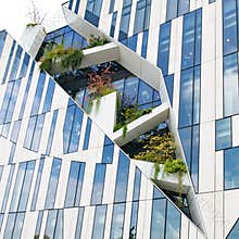 Modern high-rise building by star architect Libeskind with space for plants, trees in facade of Koe-Bogen in Dusseldorf, Germany