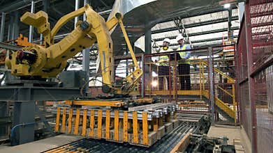 Engineers check a working machine at a brick factory. Factory male engineers in a modern factory.