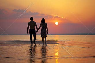 Two people in love at sunset