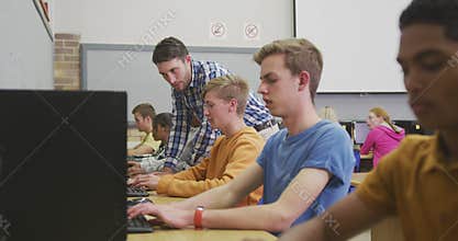 Students working on computers in high school class